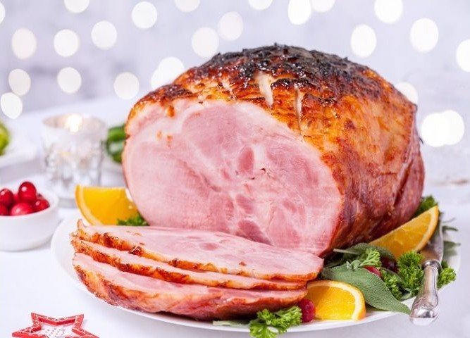 Sliced Holiday Country Ham shown sliced on a platter on a table. holiday ham Available via mail order via Chicago Steak Company